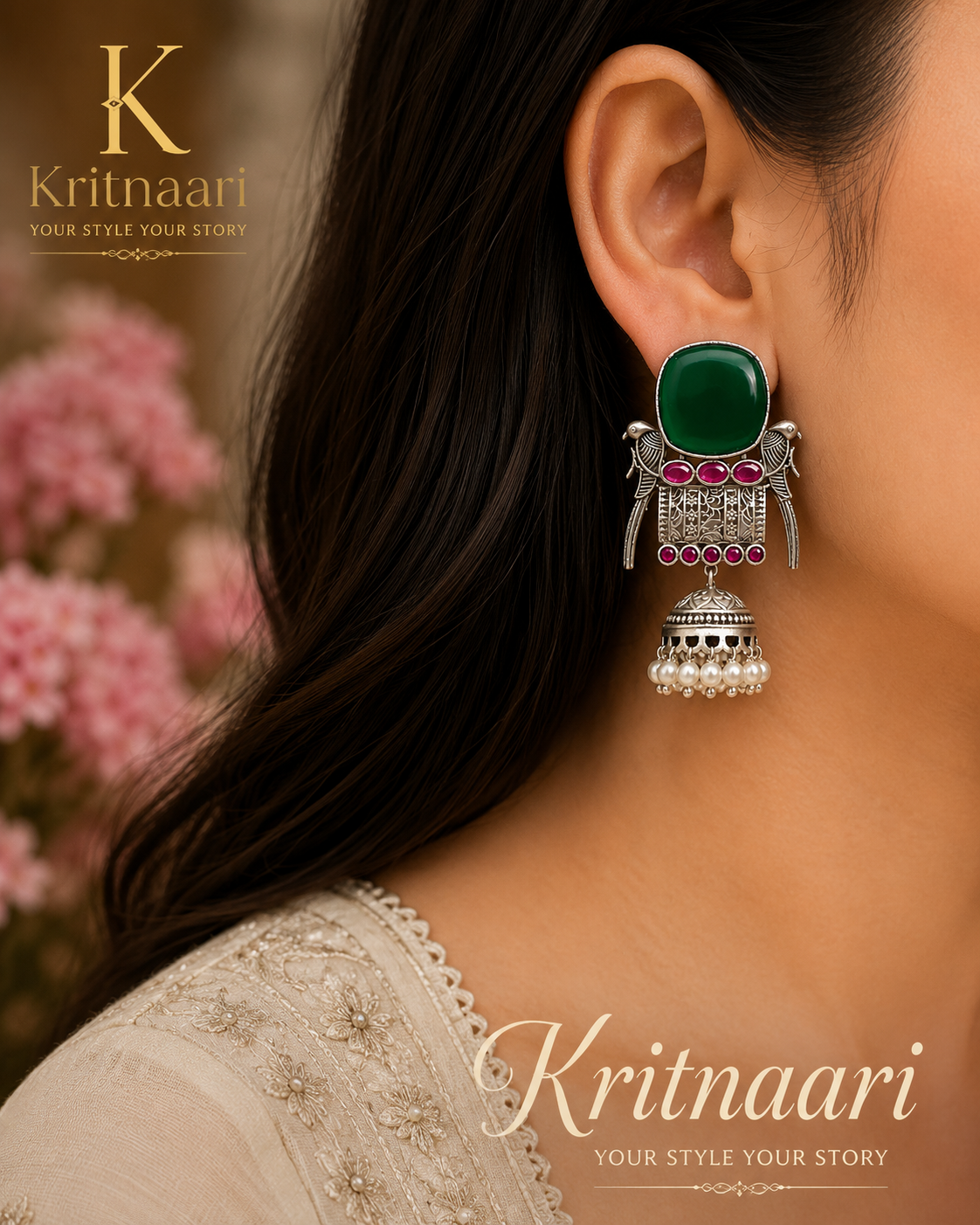 Emerald green stone jhumka earrings on display stand - pair view